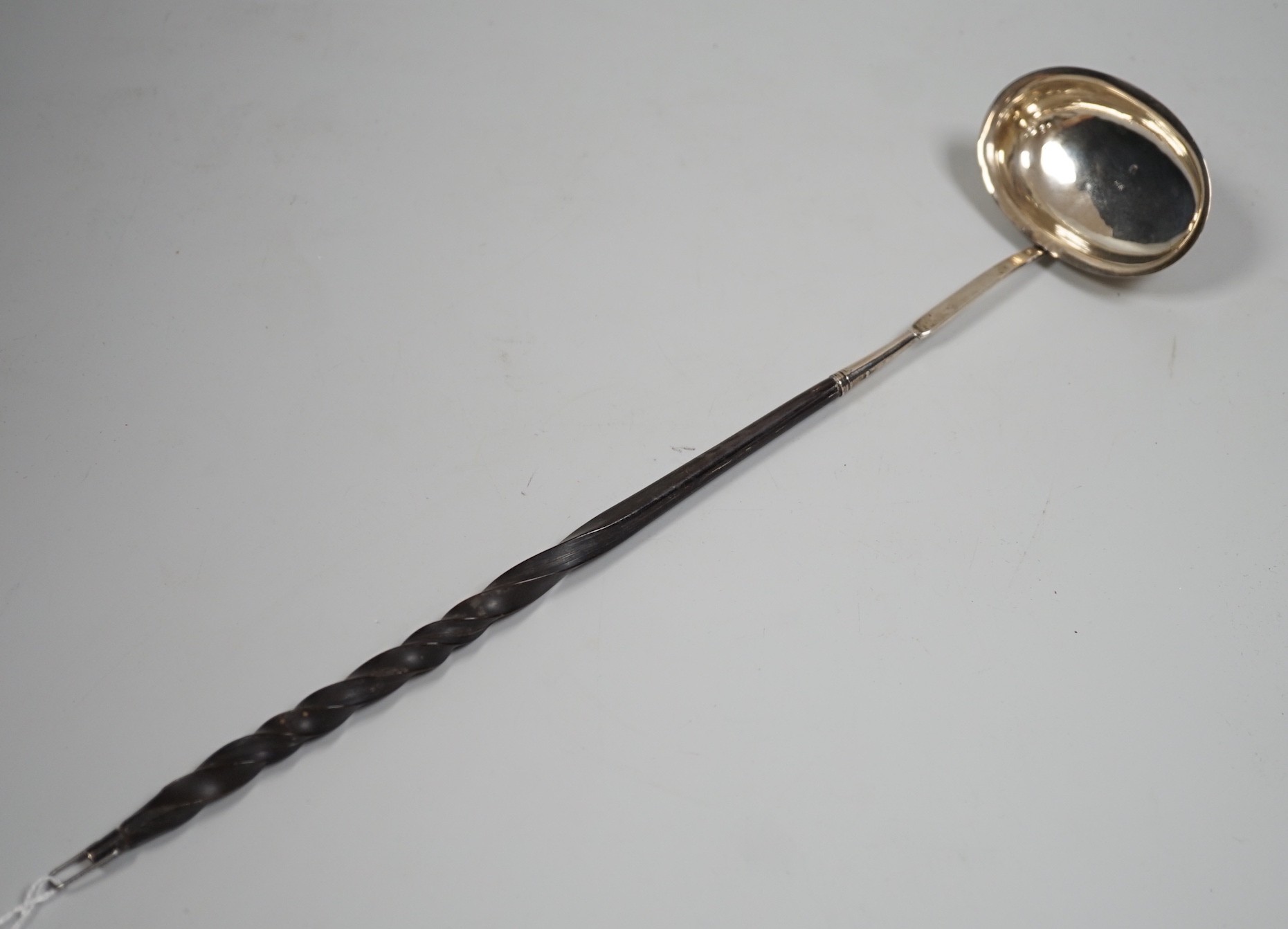 An early 19th century silver toddy ladle with demi barley twist baleen handle, maker IS?, maker's mark and duty mark only, 36.5cm.